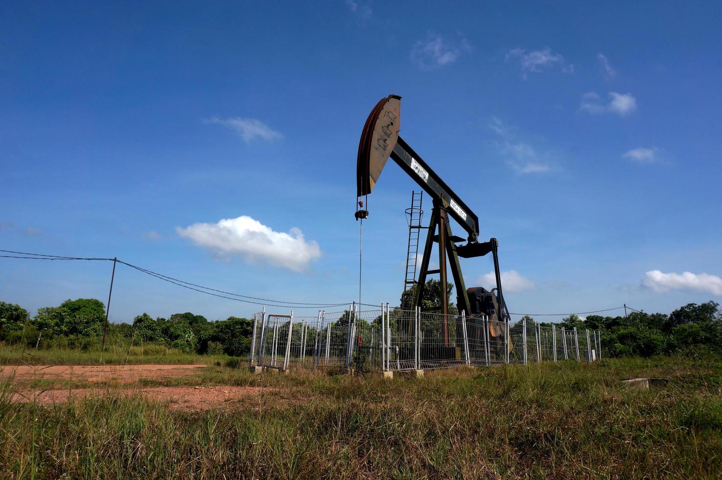 Sangatta, East Kalimantan, Indonesia, 2020 - A pumpjack is the overground drive for a reciprocating piston pump in an oil well. photo