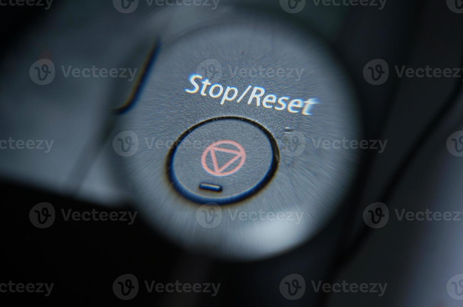 Stop or Reset button  under magnifying glass. photo