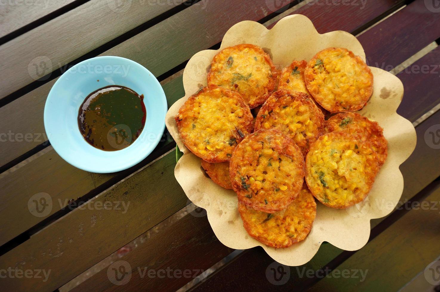 Bakwan Jagung or Corn Fritters. Corn Fritters with soy sauce petis. photo