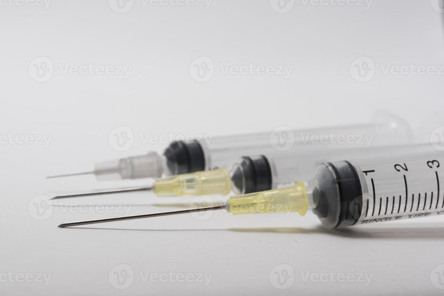 Syringes and needles on white background. photo