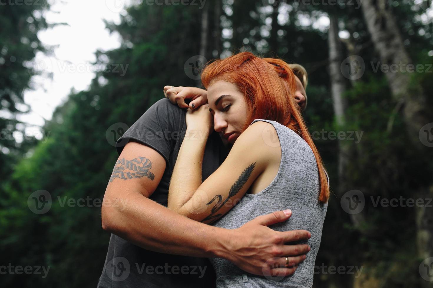 man and woman in nature photo