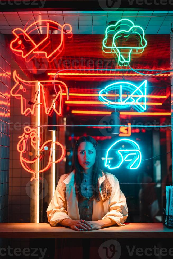 Beautiful girl in a window cafe photo