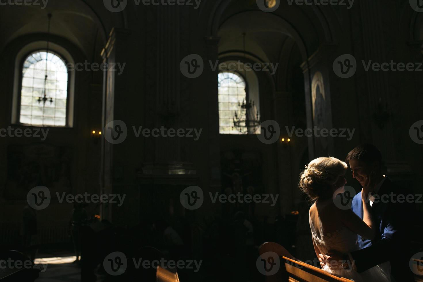 bride and groom illuminated by light photo