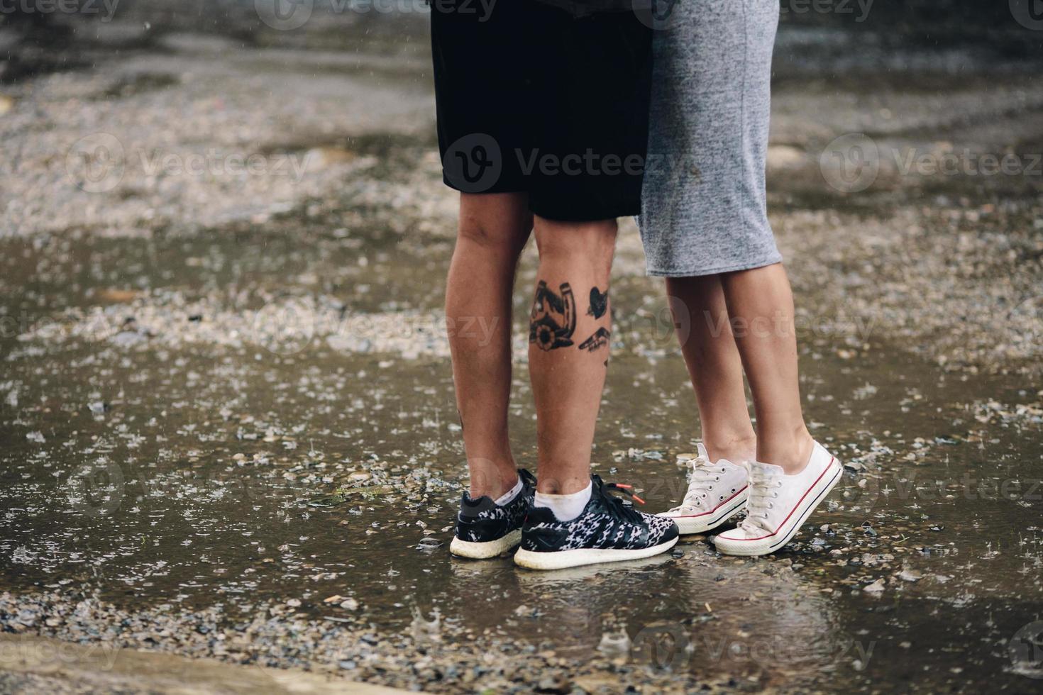 couple on the background of wet asphalt photo