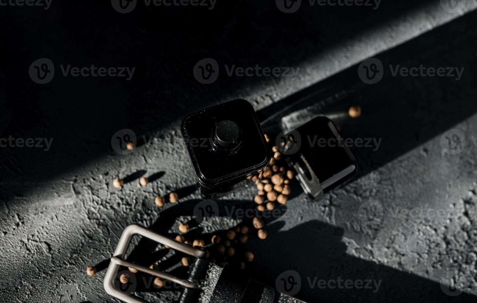 black bottle of men's perfume photo