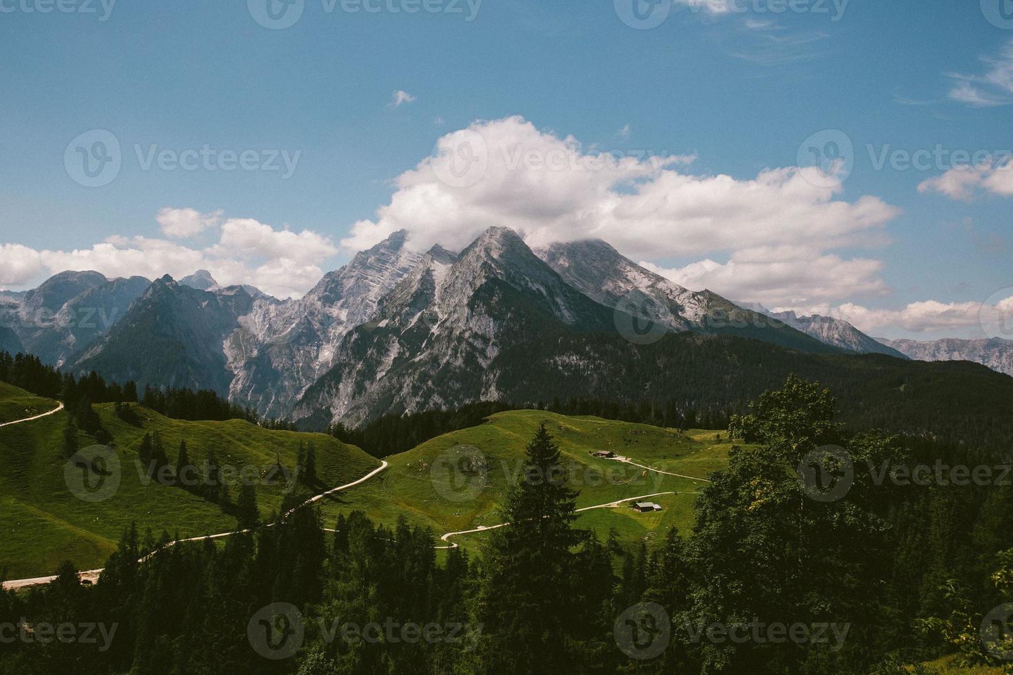 a path among mountains in the summer photo