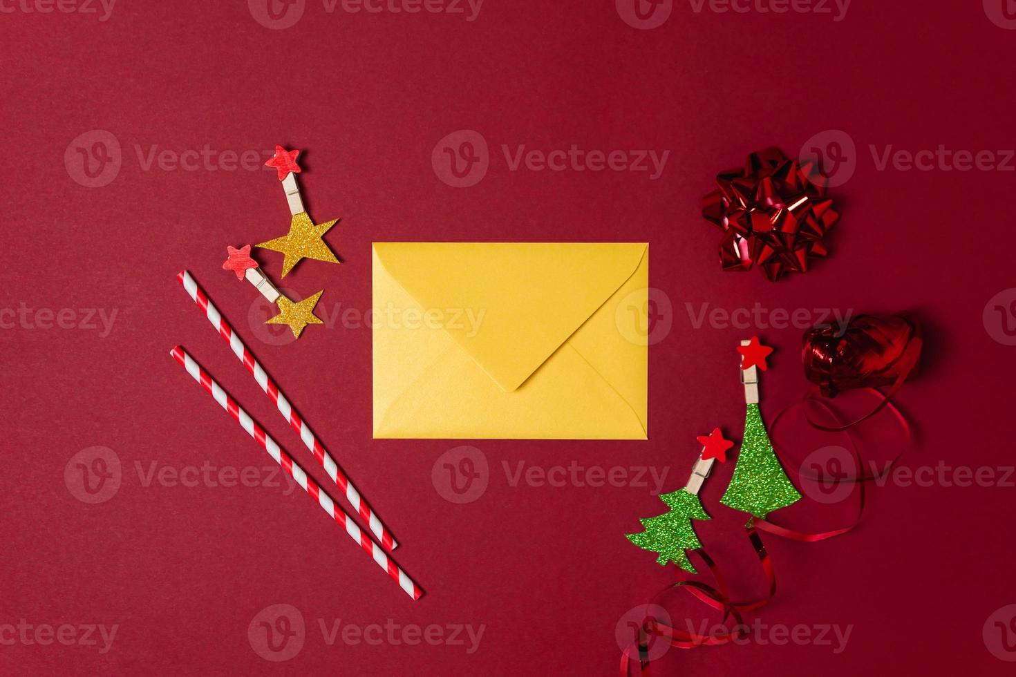 New Year and Christmas decorations on red background, flat lay. Concept of greeting card for holidays photo