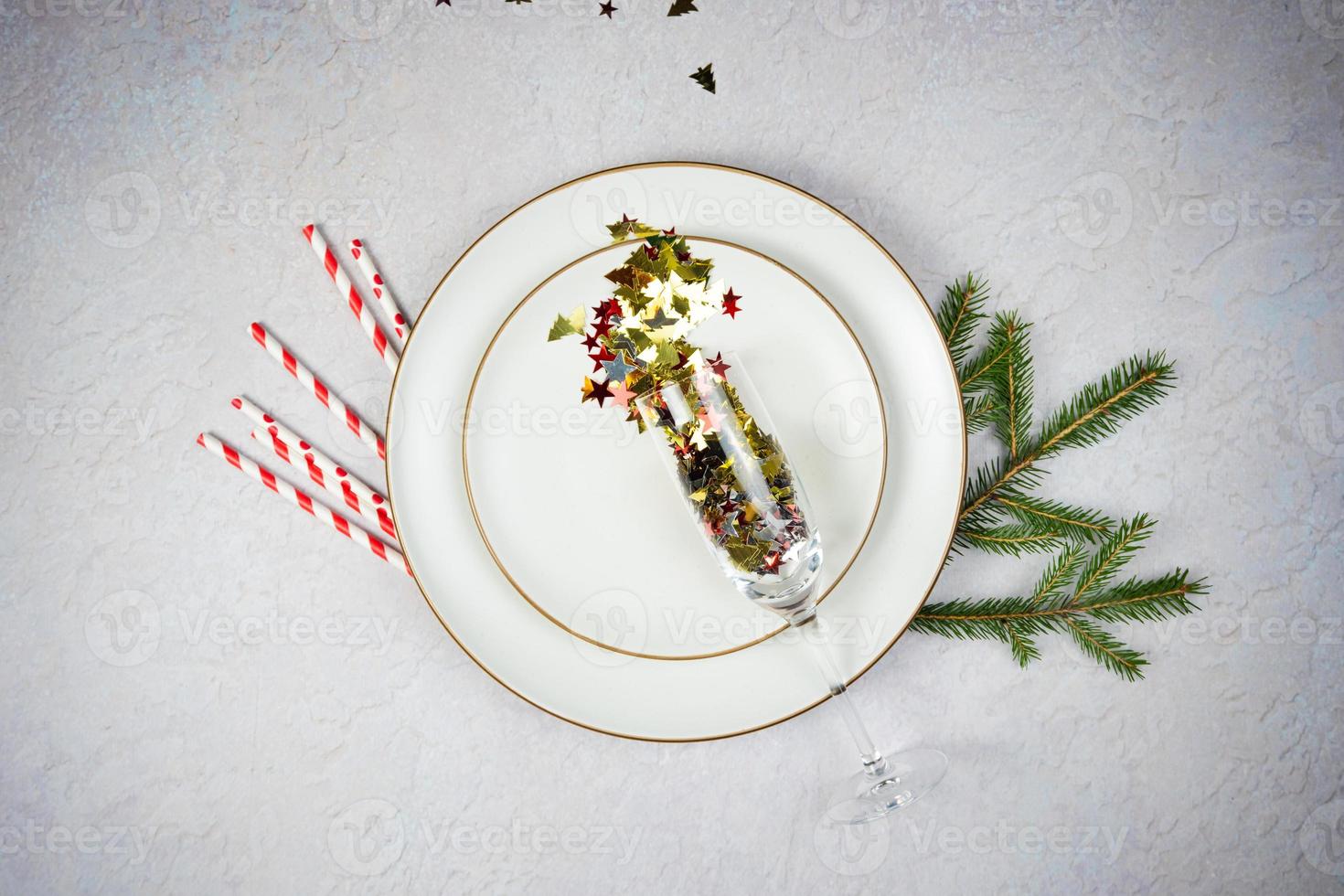 Empty Plate with Christmas decorations and fir tree on wooden background, flat lay. photo