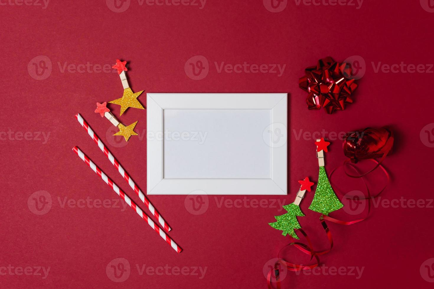 New Year and Christmas decorations on red background, flat lay. photo