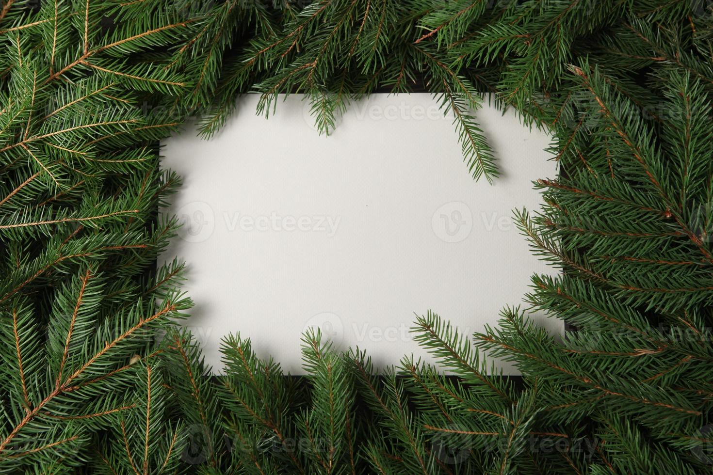 Holidays greeting card or banner composition with pine tree branches. Merry Christmas background and Happy New Year 2023. photo