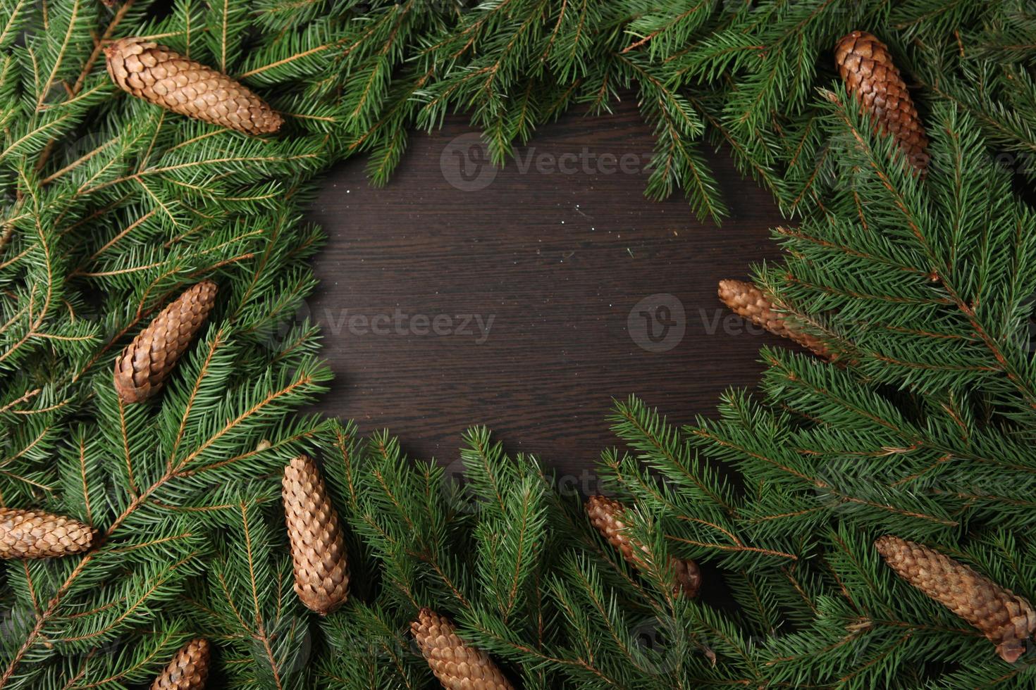 Holidays greeting card or banner composition with pine tree branches. Merry Christmas background and Happy New Year 2023. photo