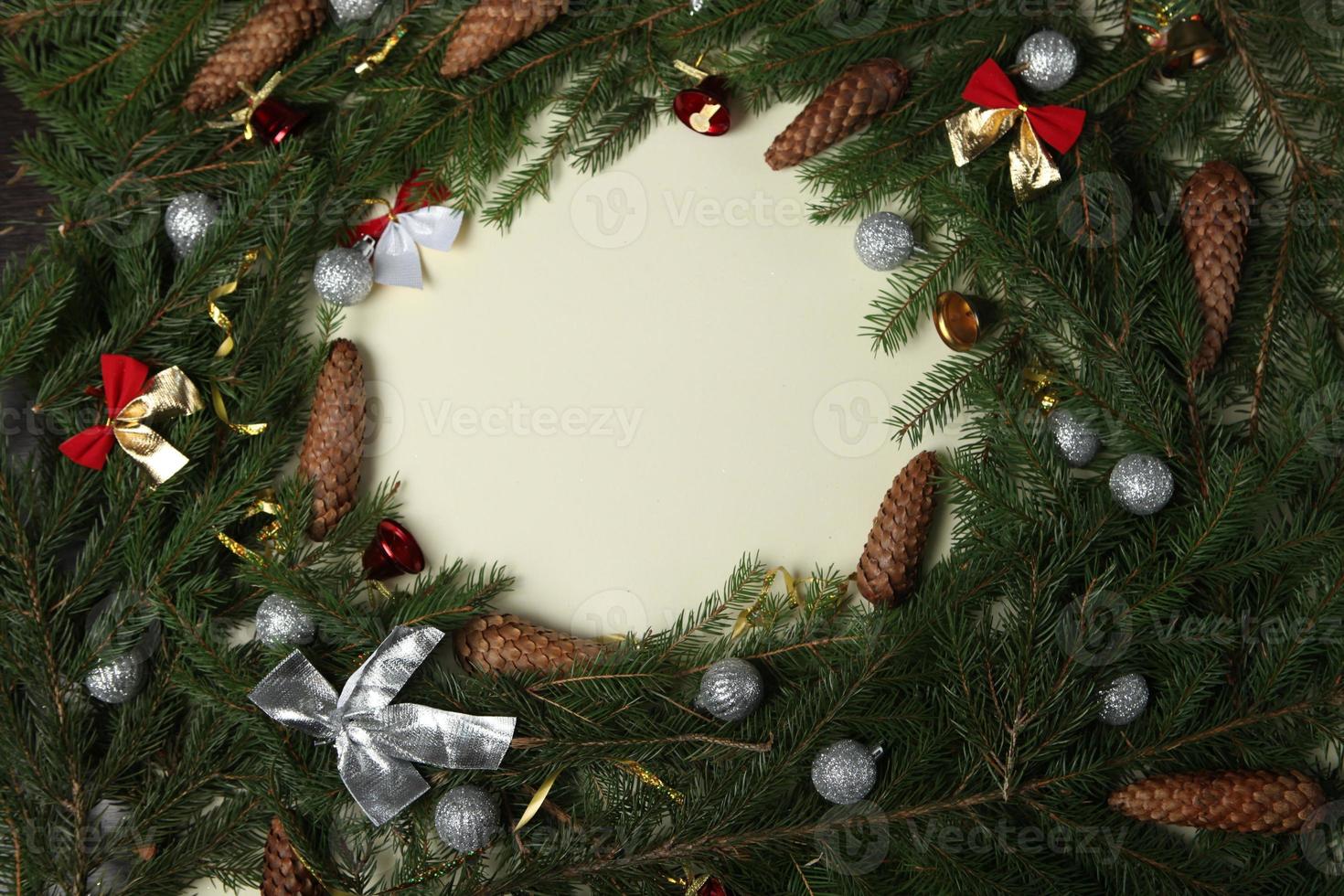 Holidays greeting card or banner composition with pine tree branches. Merry Christmas background and Happy New Year 2023. photo