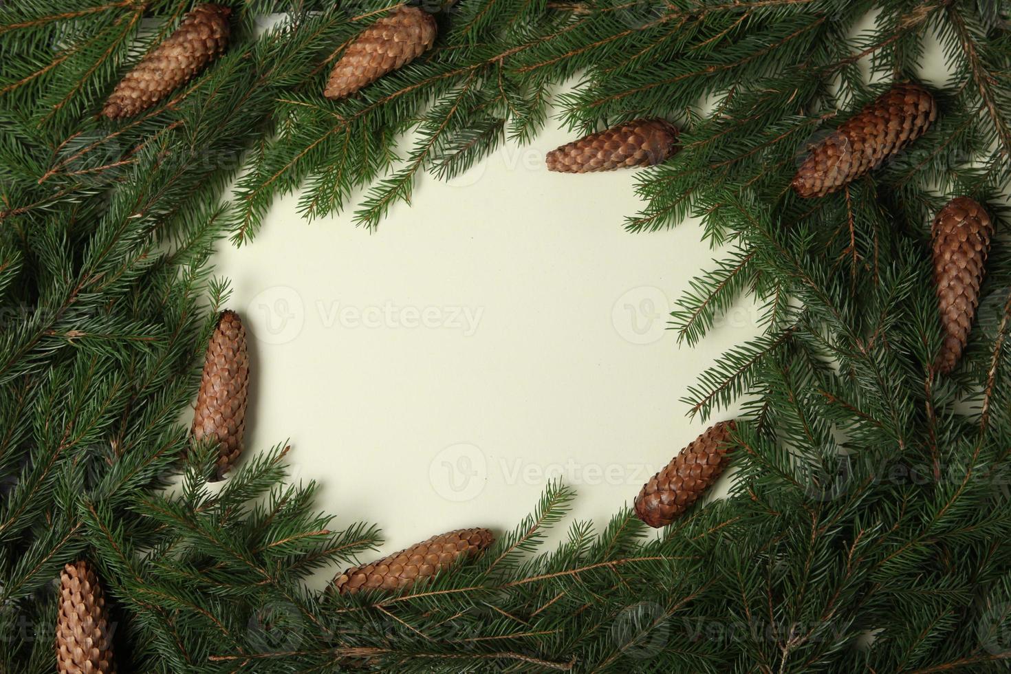 Holidays greeting card or banner composition with pine tree branches. Merry Christmas background and Happy New Year 2023. photo