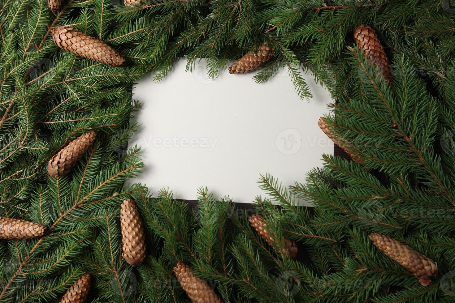 Holidays greeting card or banner composition with pine tree branches. Merry Christmas background and Happy New Year 2023. photo