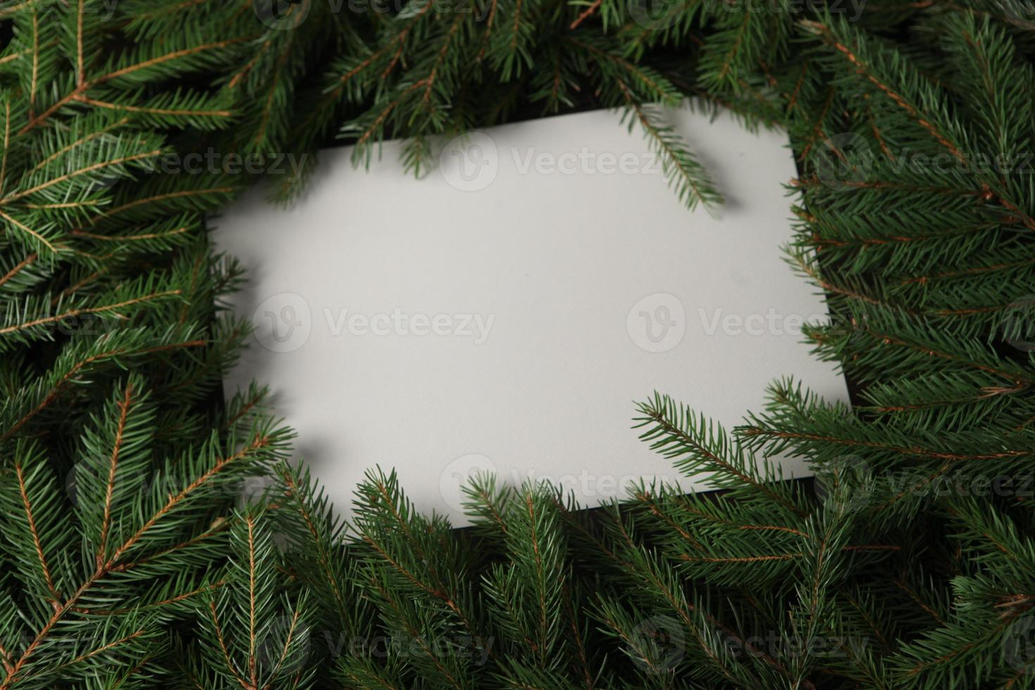 Holidays greeting card or banner composition with pine tree branches. Merry Christmas background and Happy New Year 2023. photo