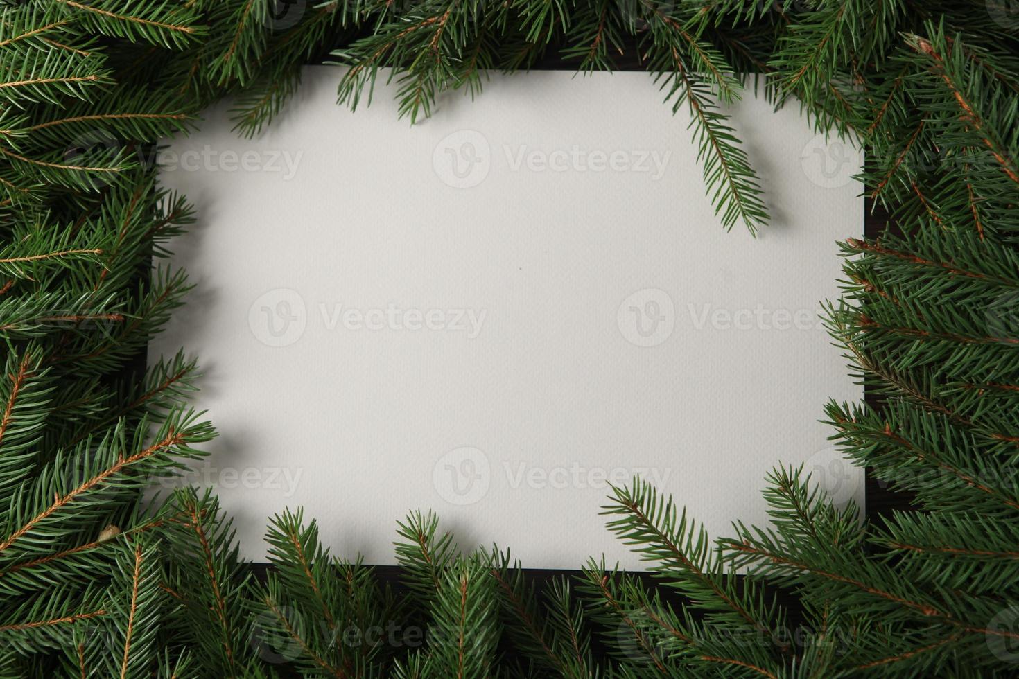 Holidays greeting card or banner composition with pine tree branches. Merry Christmas background and Happy New Year 2023. photo