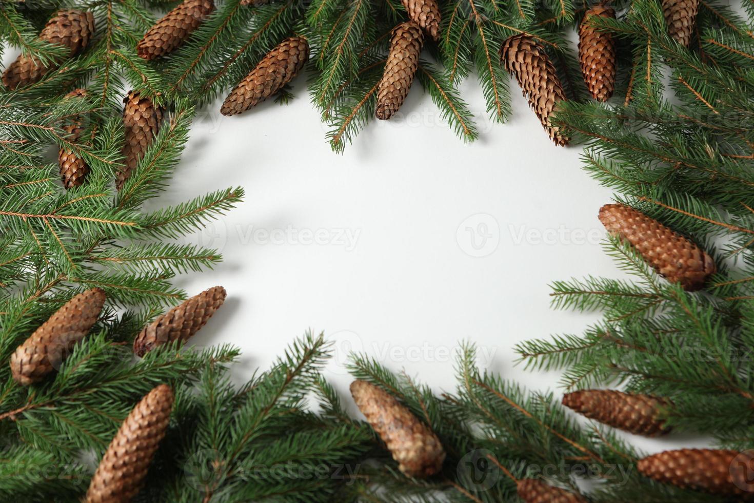 Holidays greeting card or banner composition with pine tree branches. Merry Christmas background and Happy New Year 2023. photo