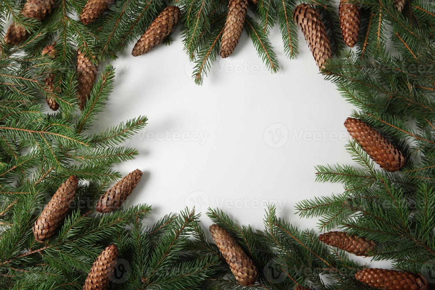 Holidays greeting card or banner composition with pine tree branches. Merry Christmas background and Happy New Year 2023. photo