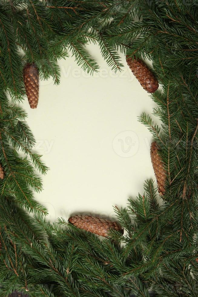 Holidays greeting card or banner composition with pine tree branches. Merry Christmas background and Happy New Year 2023. photo