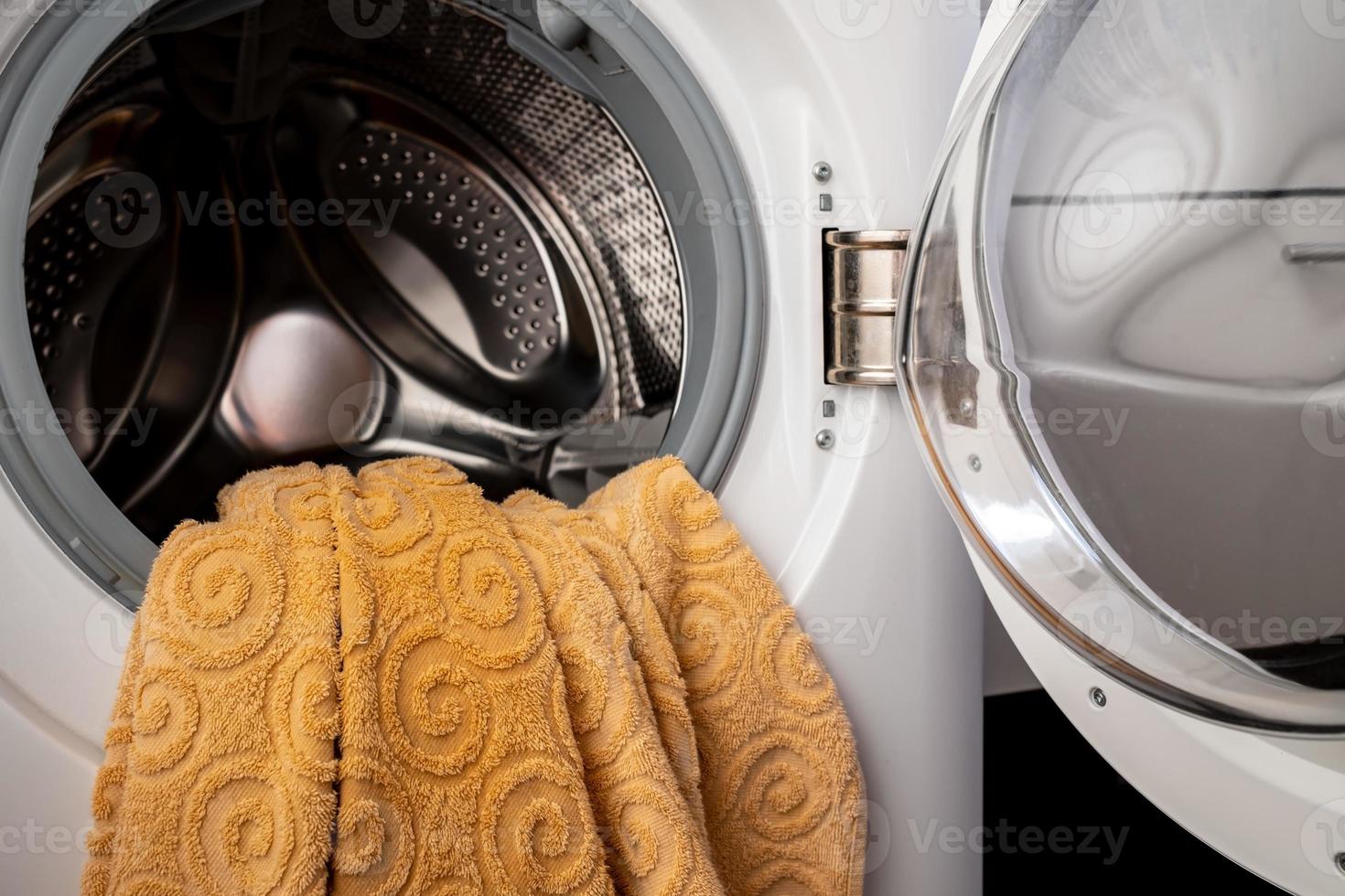 laundry in an open washing machine in the bathroom 14211722 Stock Photo