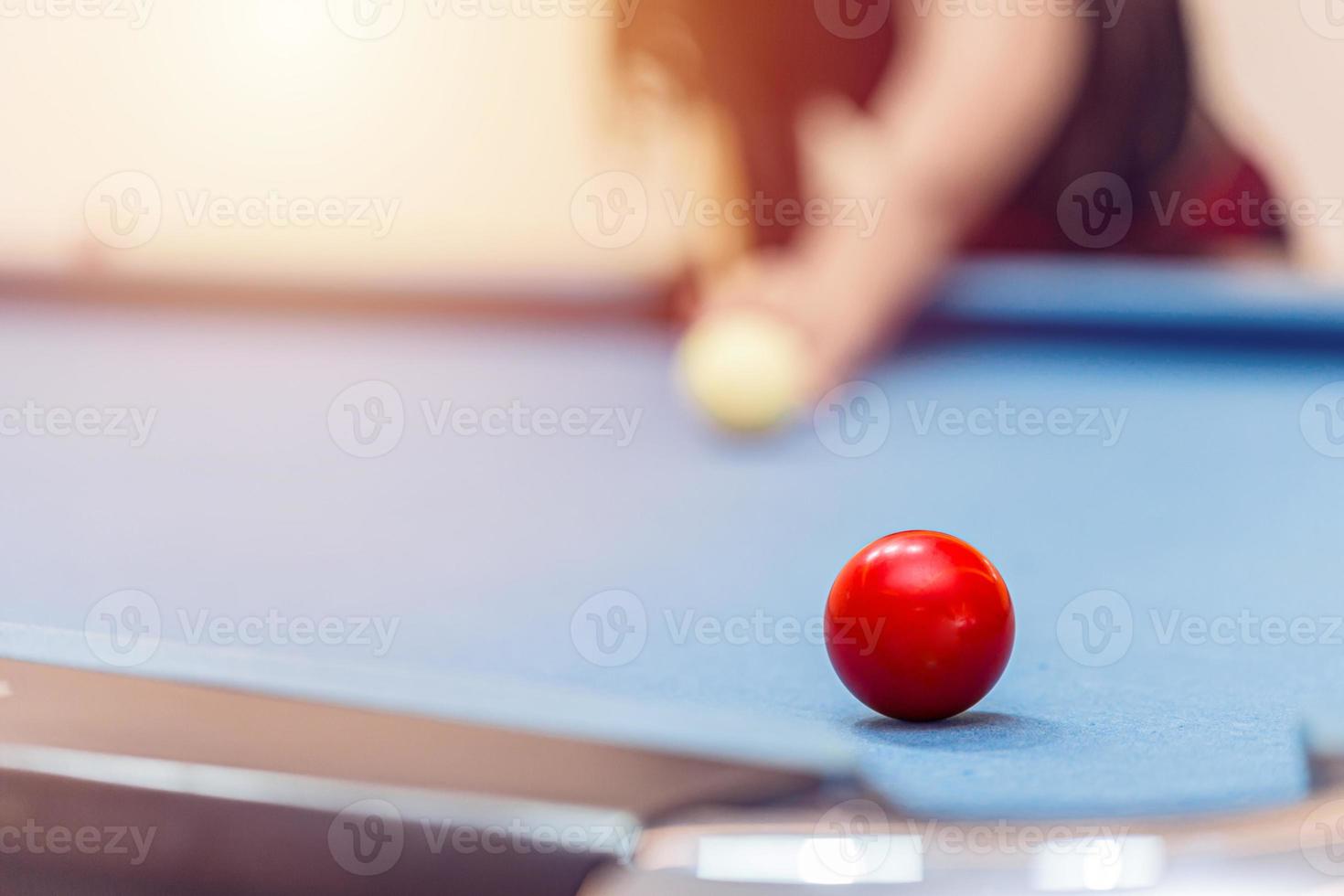 Playing Billiard or Pool Snooker Table closeup at red ball aim shot.Business target concept. photo