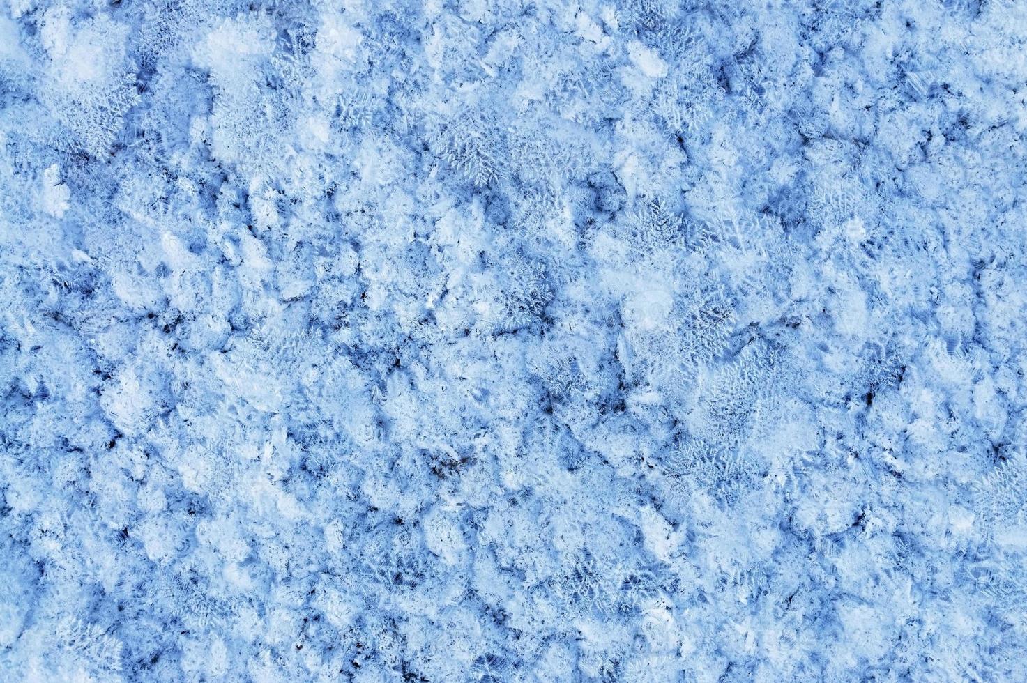 Winter or Christmas background with snow patterns, crystals close-up and snowflakes. photo