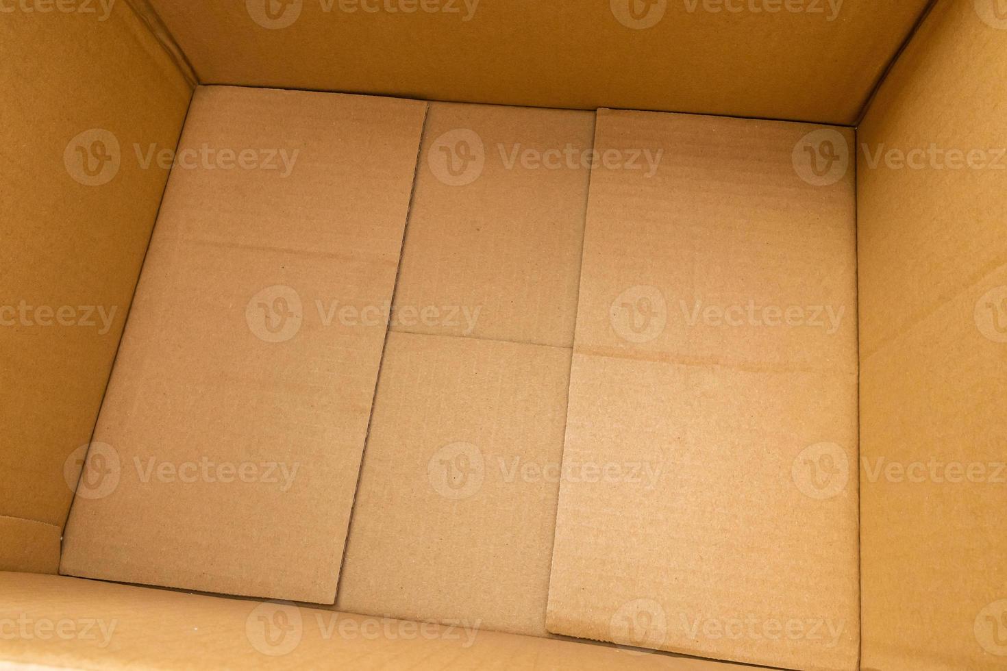 Open empty brown cardboard box background top view photo