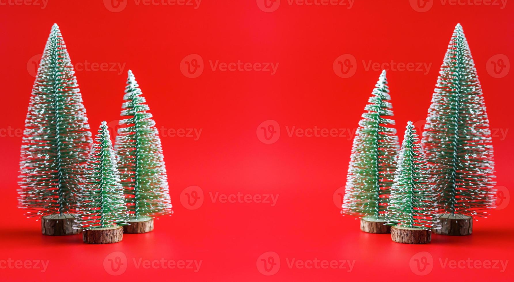 Christmas tree on red background new year  holiday celebration concept photo