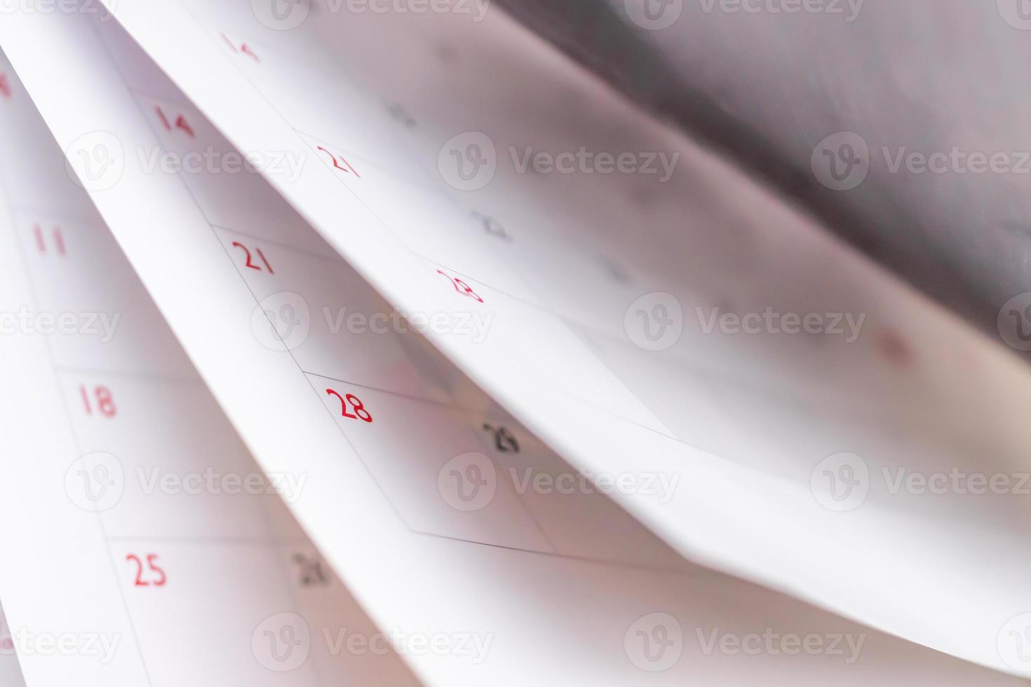 Calendar page flipping sheet close up blur background business schedule planning appointment meeting concept photo