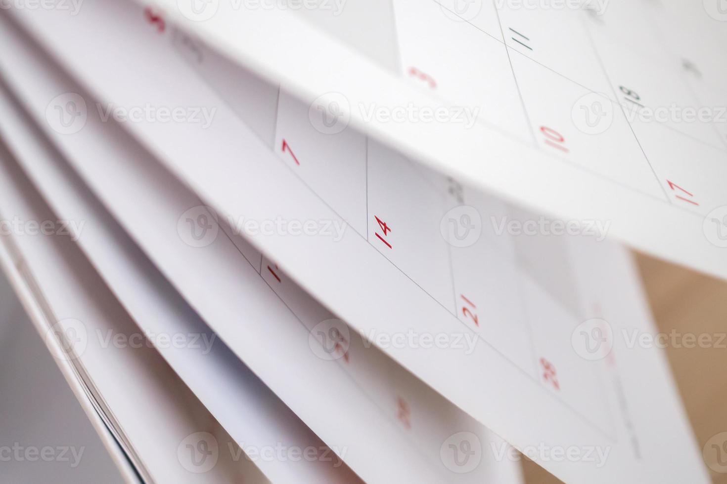 Calendar page flipping sheet close up blur background business schedule planning appointment meeting concept photo