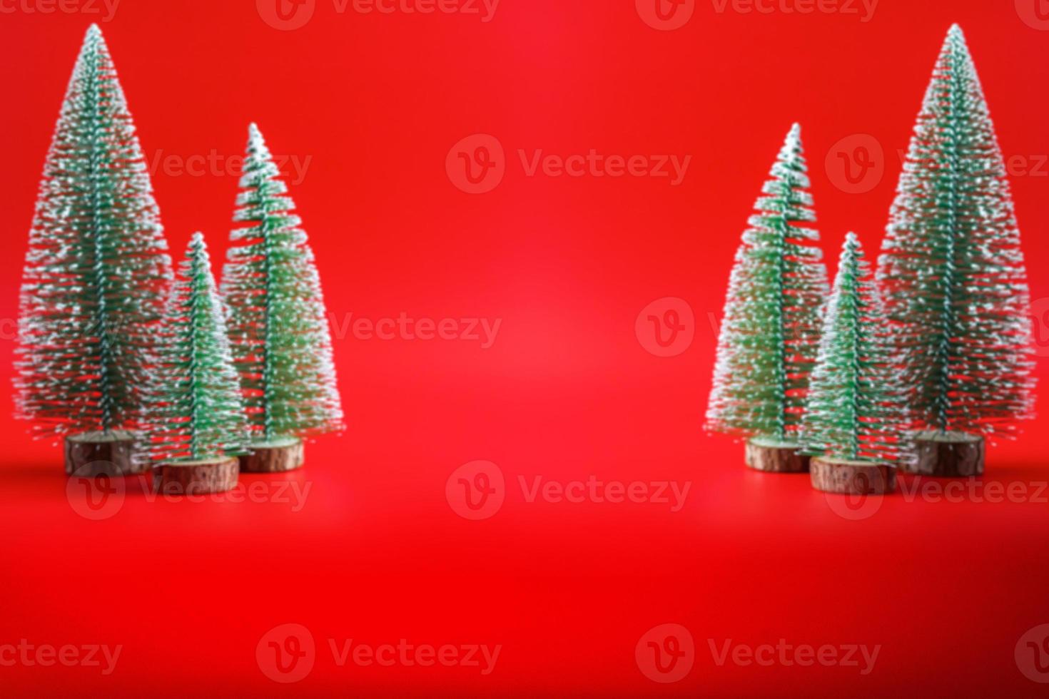 Abstract blur Christmas tree on red background new year  holiday celebration concept photo