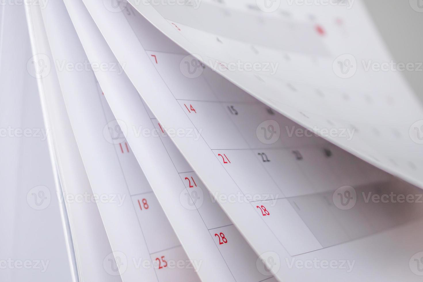 Calendar page flipping sheet close up blur background business schedule planning appointment meeting concept photo