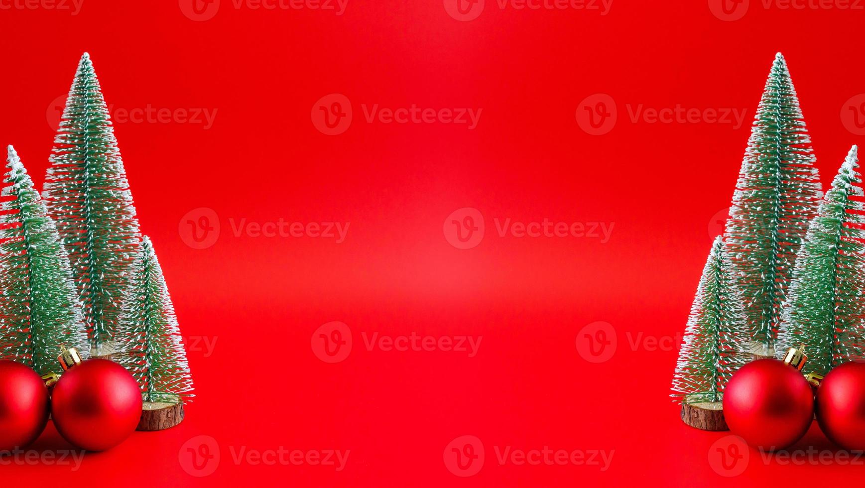 Christmas tree and baubles on red background new year  holiday celebration concept photo