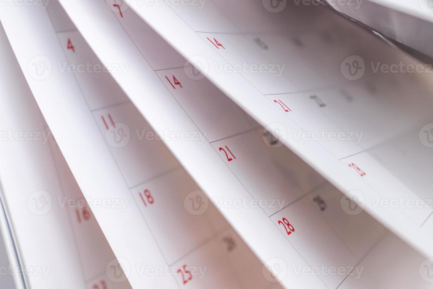 Calendar page flipping sheet close up blur background business schedule planning appointment meeting concept photo