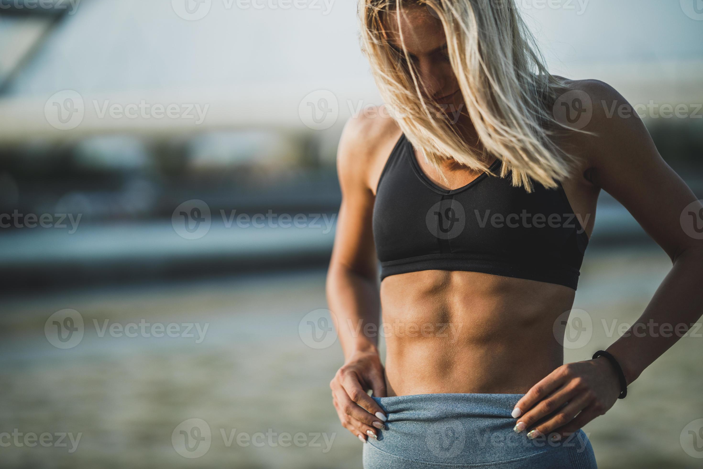 Fitness Woman Showing Her Six Pack 14220914 Stock Photo at Vecteezy