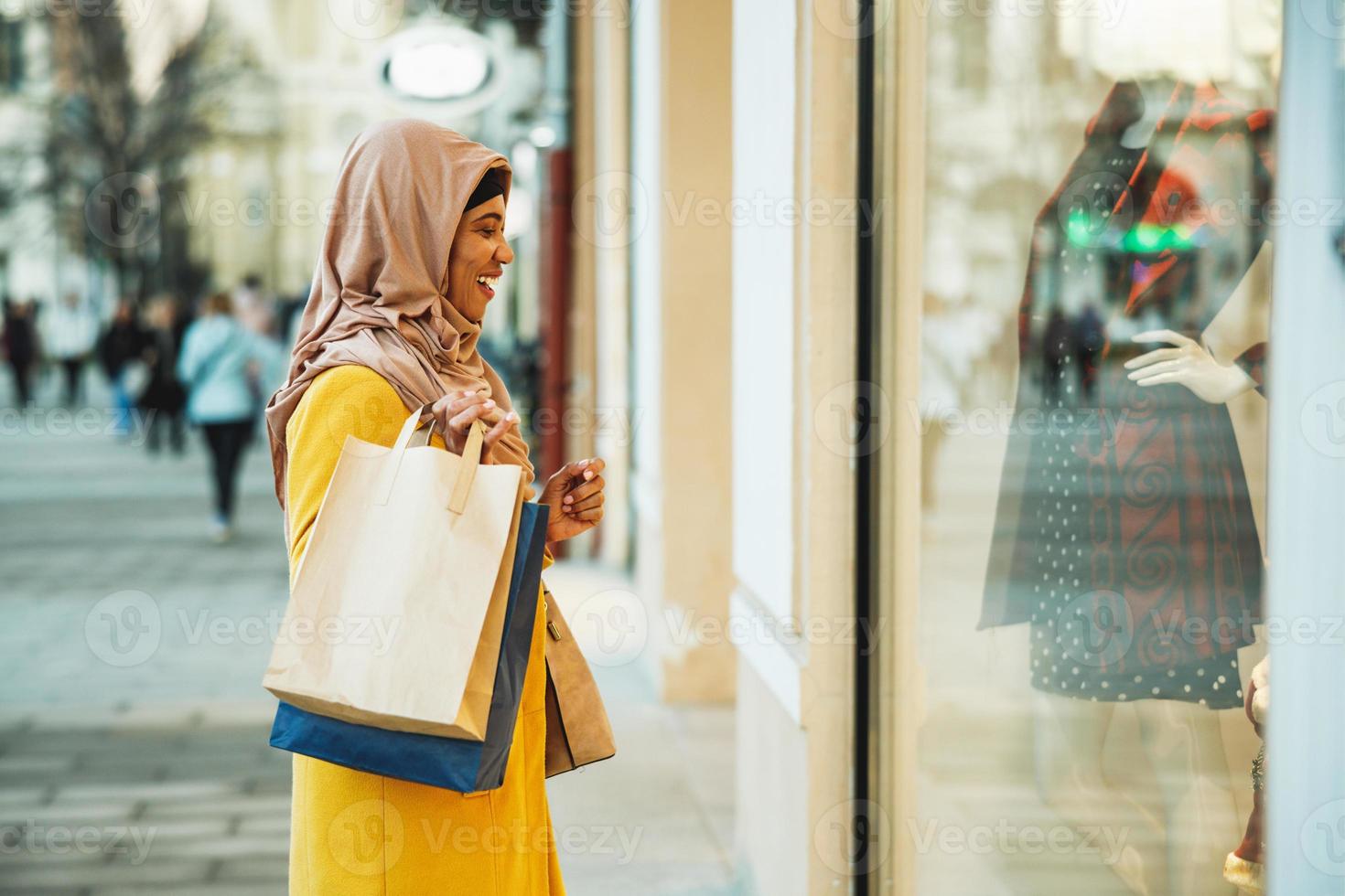 Black Muslim Woman With Hijab In The Shopping photo