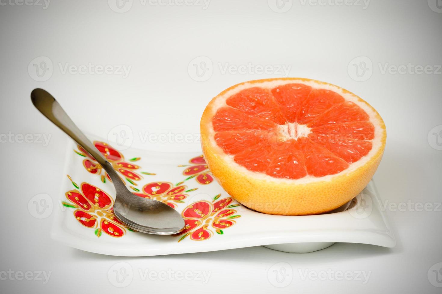 Halved red grapefruit photo