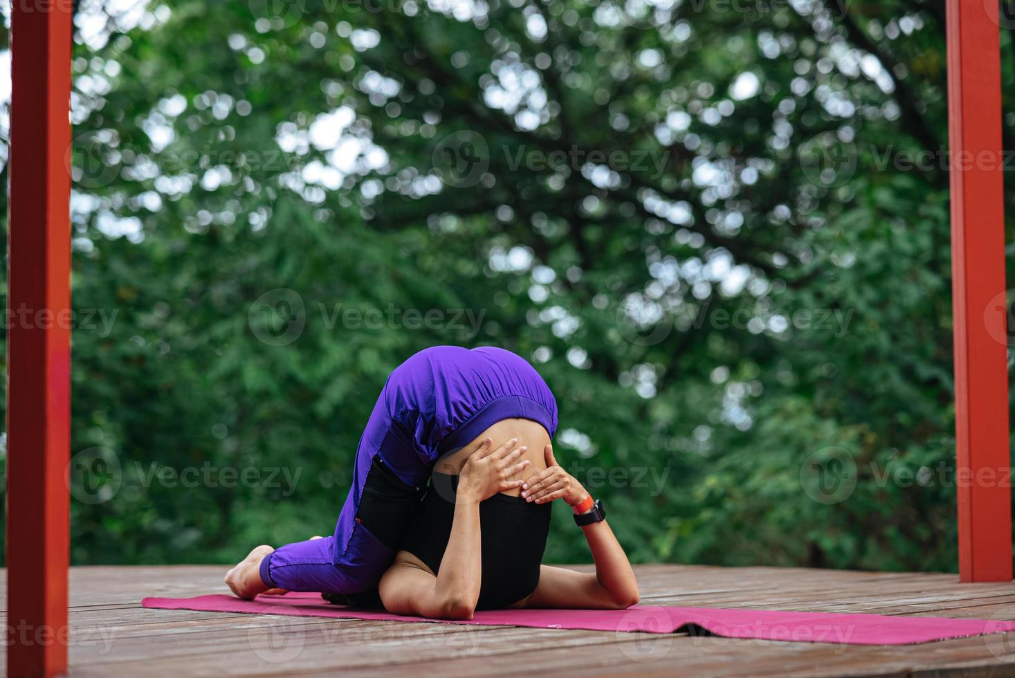 Young beautiful woman doing fitness exercises lying on her back photo