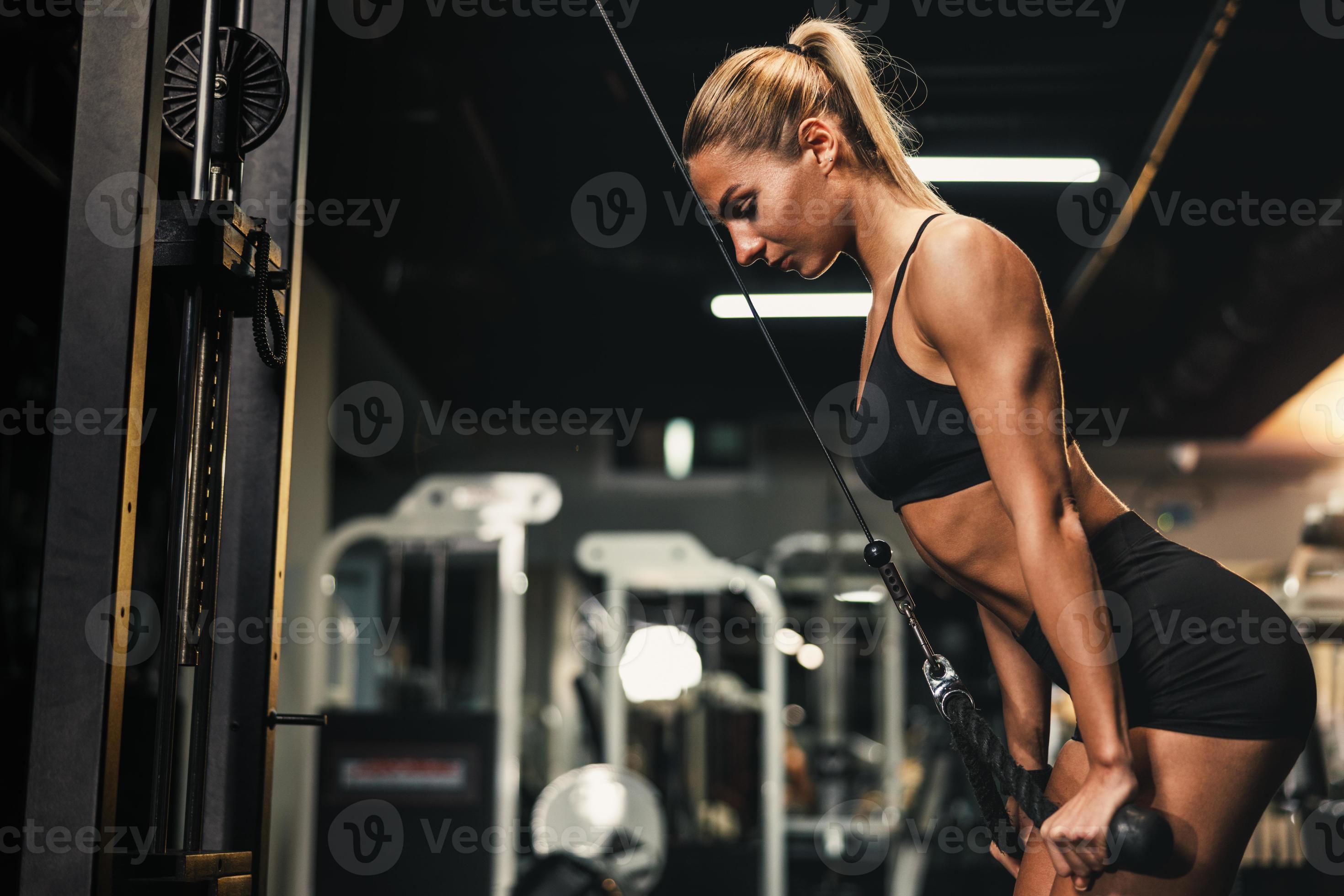 Woman Doing Training On Machine For Her Triceps Muscle At The Gym 14227902  Stock Photo at Vecteezy