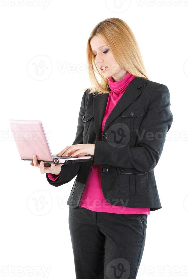 Beautiful businesswoman using her laptop photo