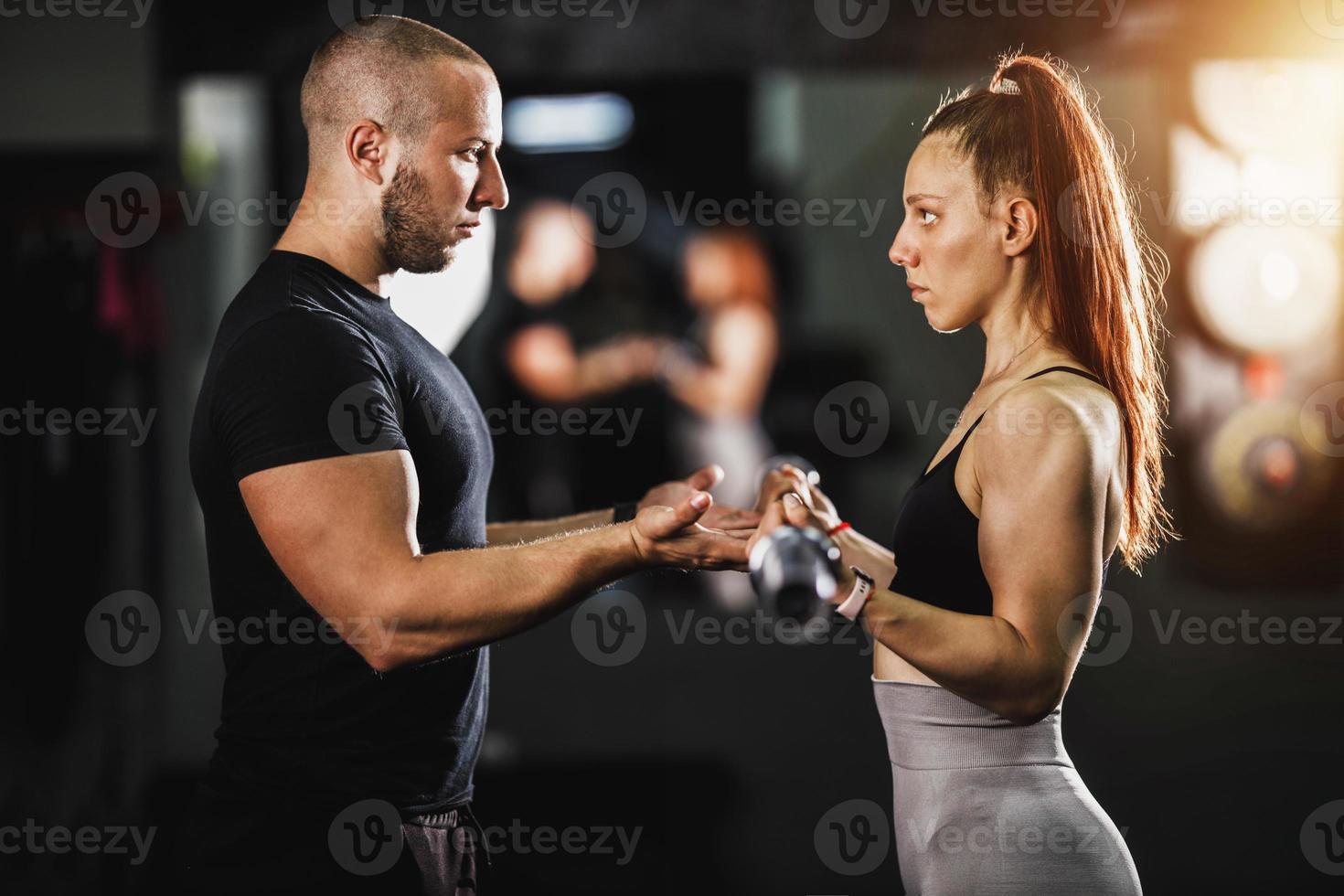 Fitness Instructor Working With Clients photo