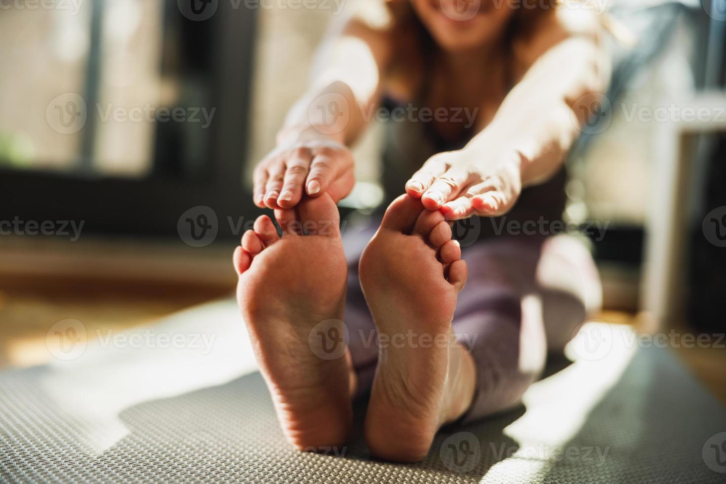 Woman Practicing A Yoga Routine At Home photo