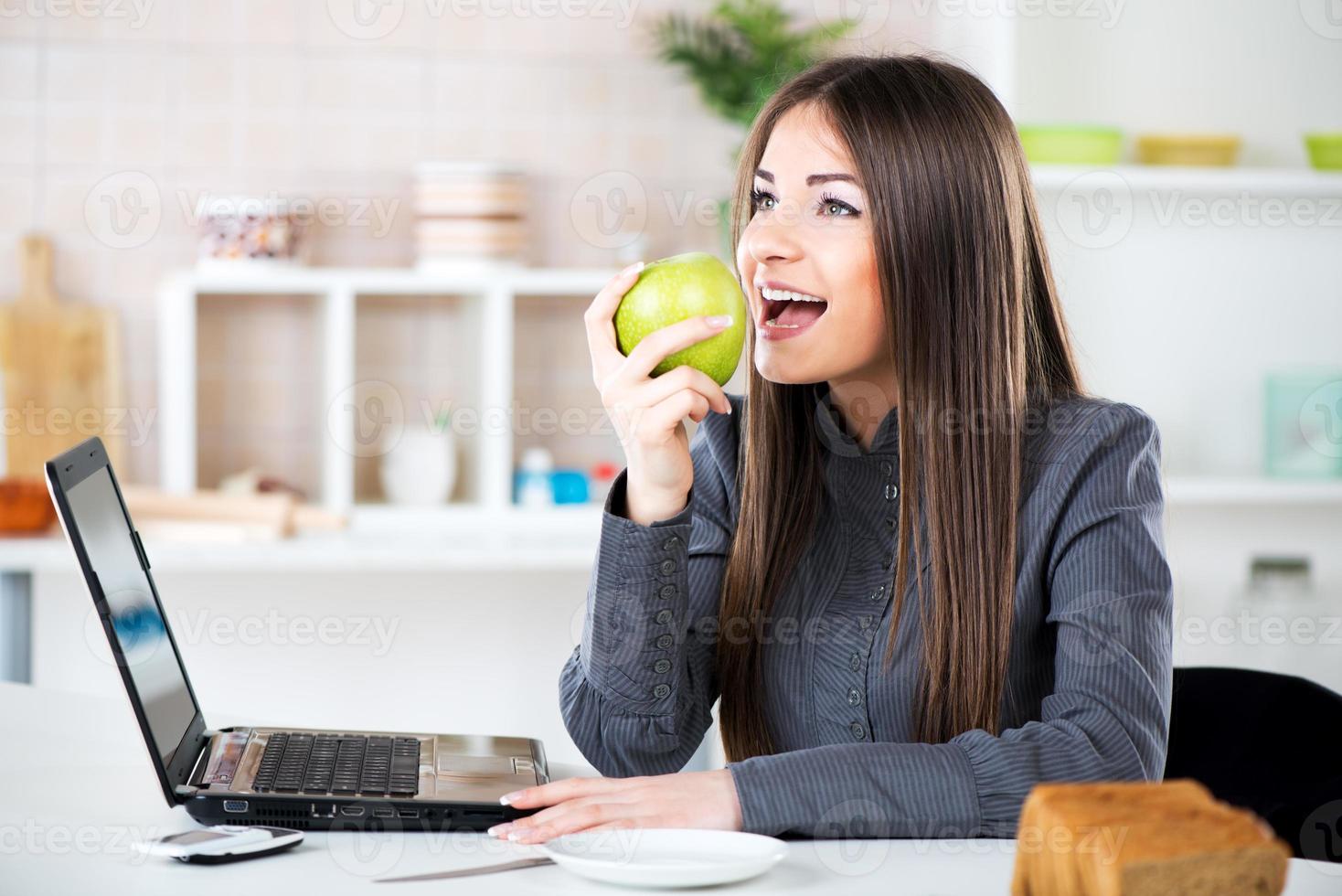 Businesswoman Eating Apple photo