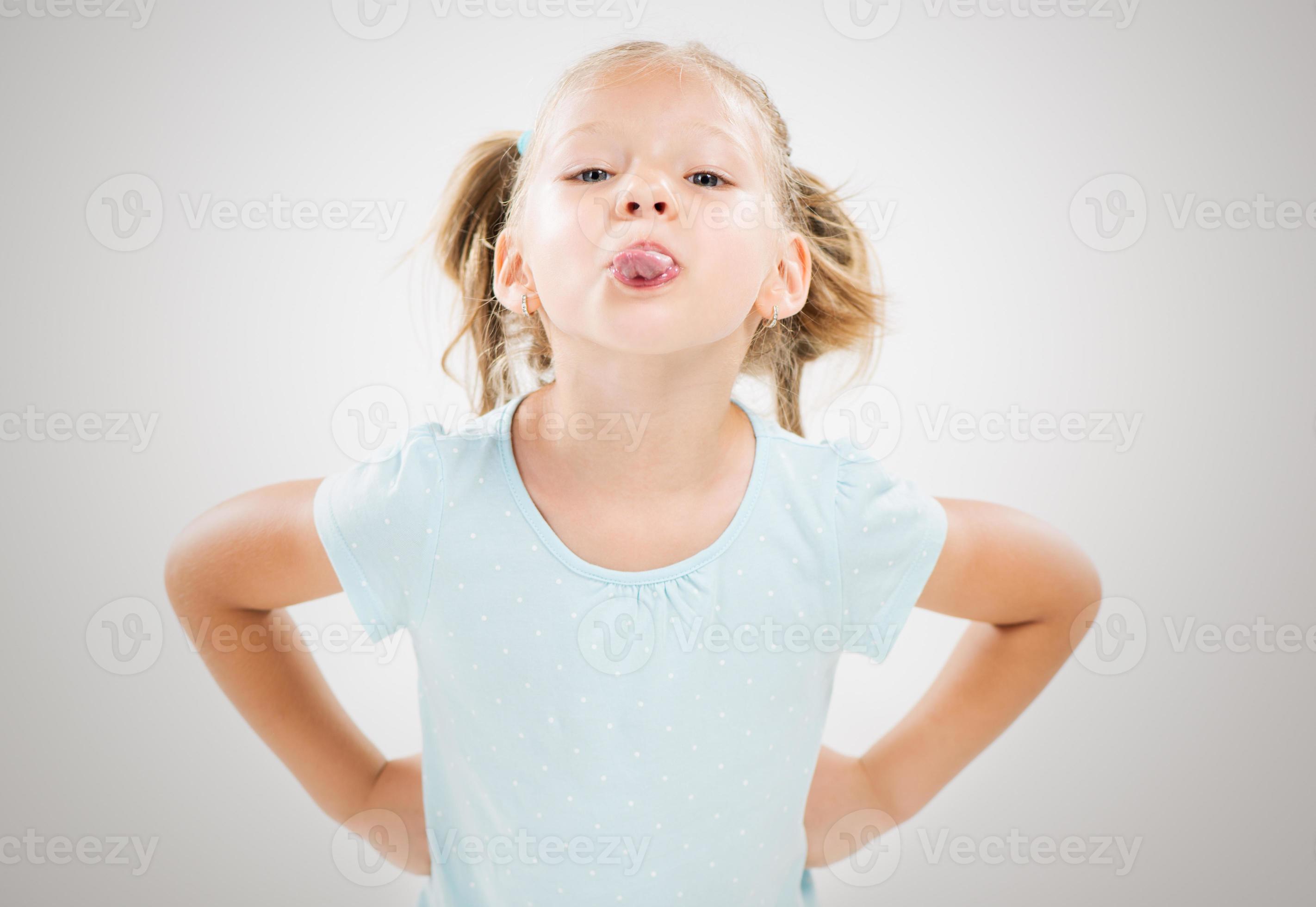 little girl tongue out 