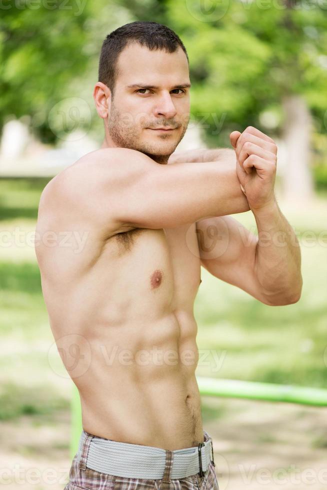 Man Stretching In The Park photo