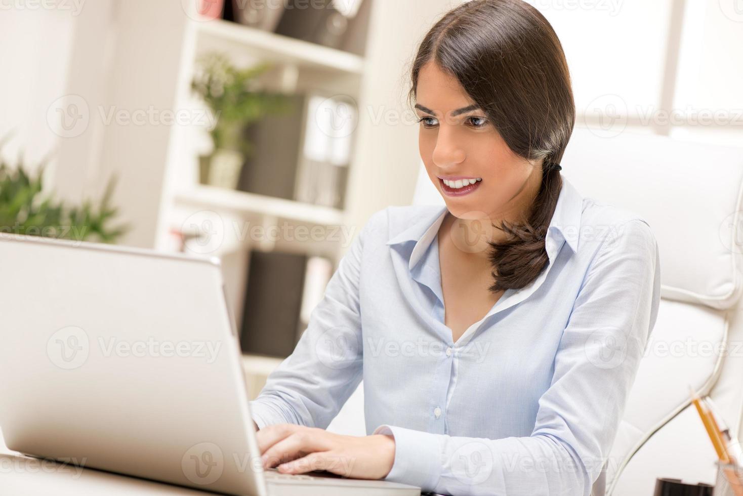 Businesswoman Working On Laptop photo