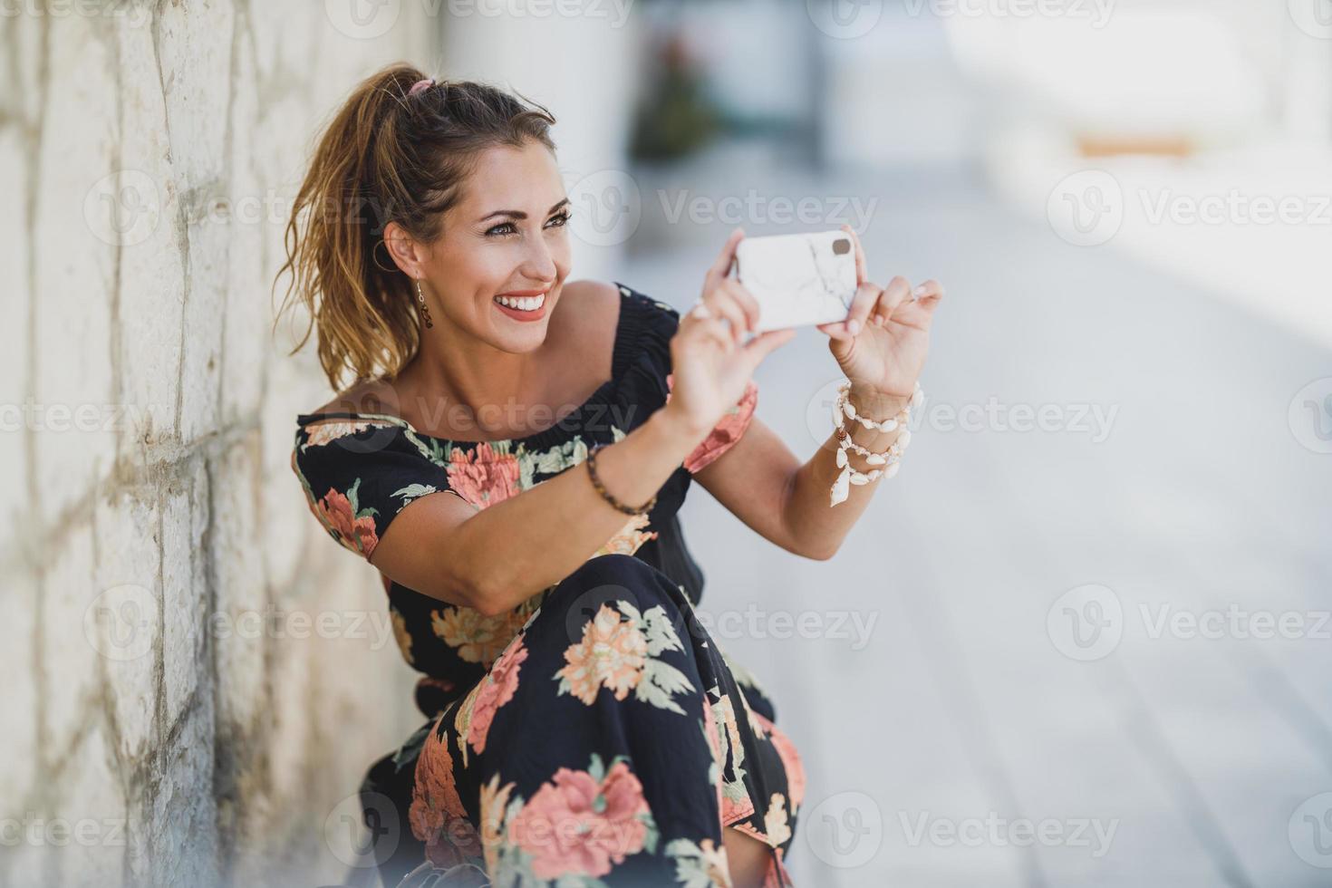 Woman Taking Photos With Smartphone And Making Memories From Holiday