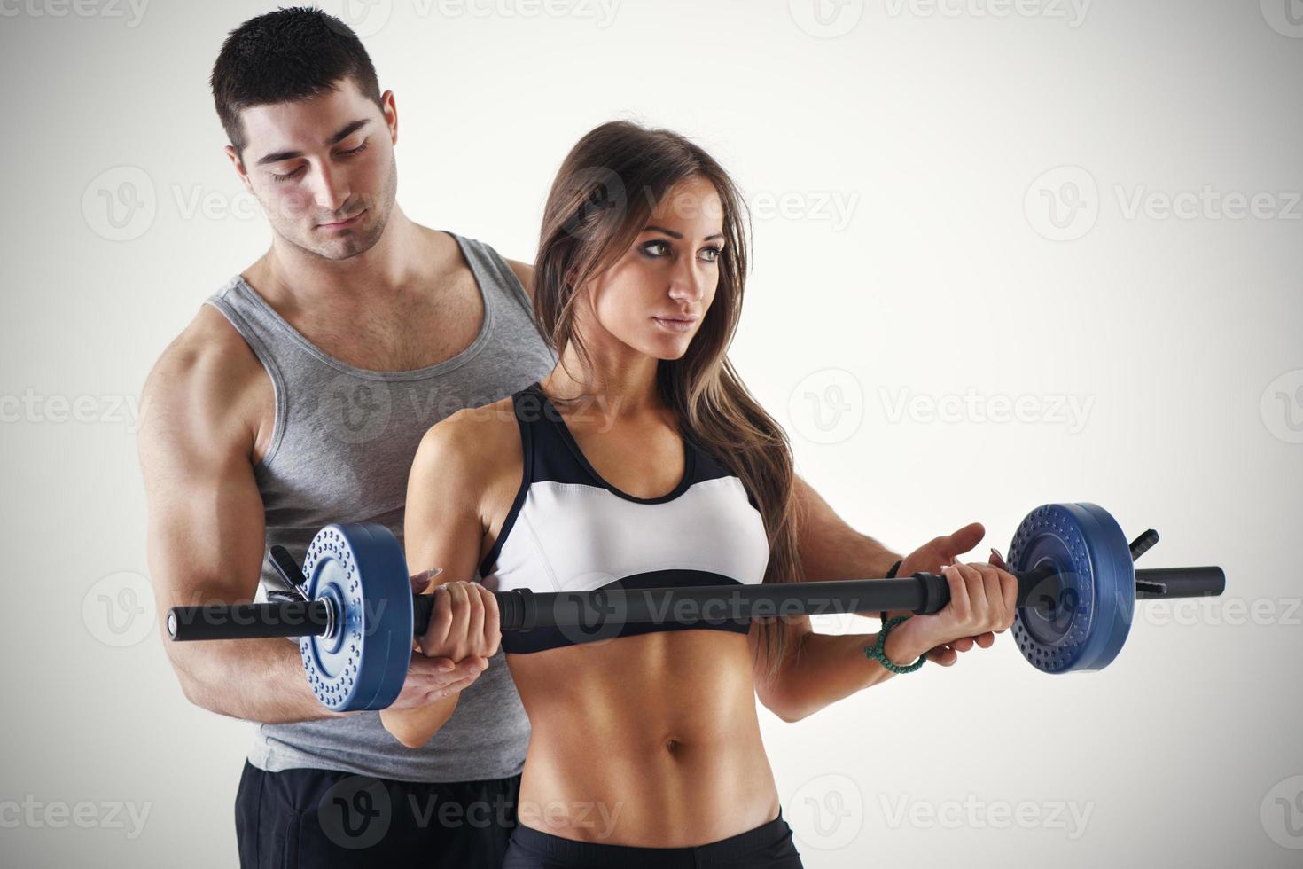 Personal Trainer Assisting A Client photo