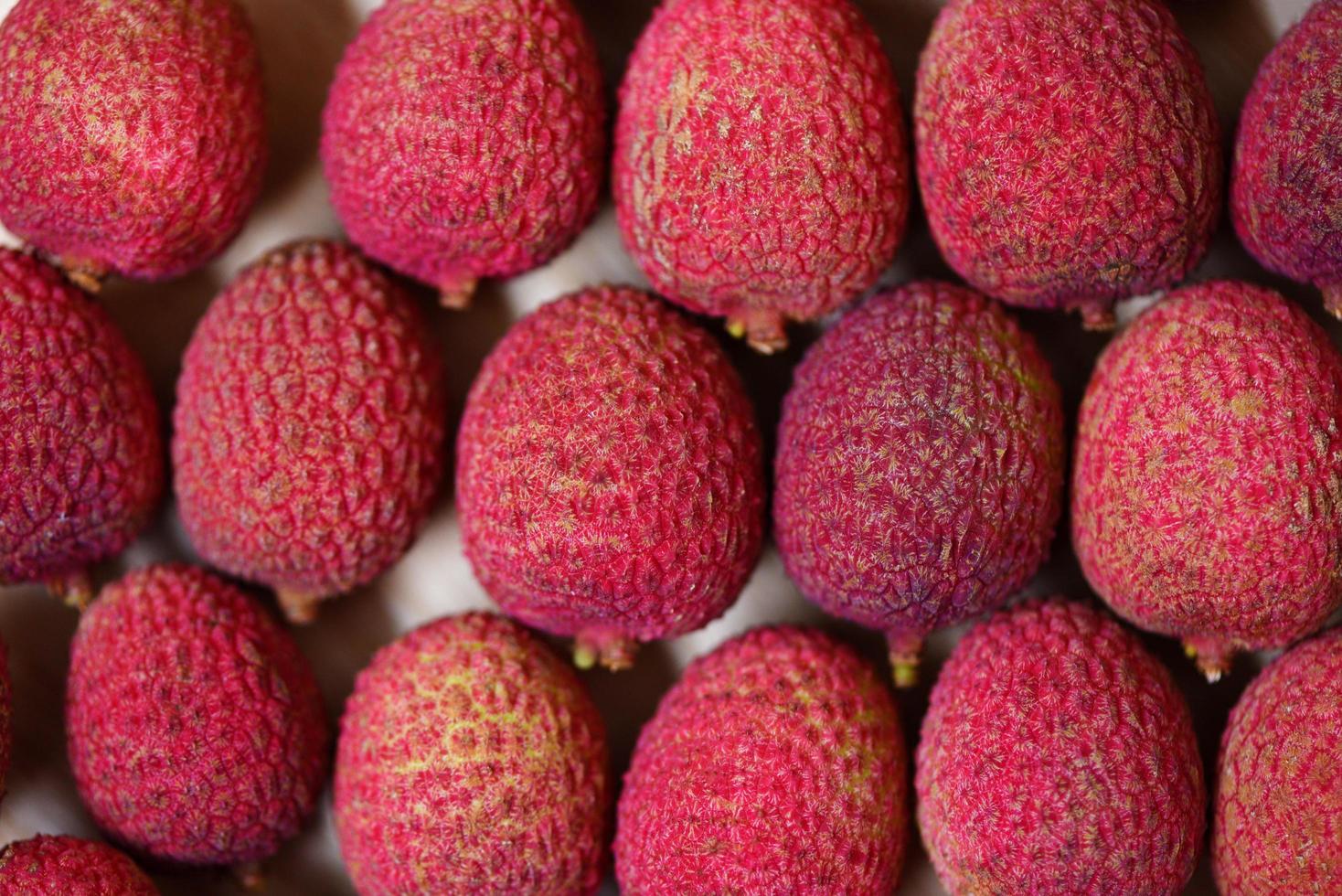 Lychee texture background top view Fresh lychee harvest from tree tropical fruit summer in Thailand photo