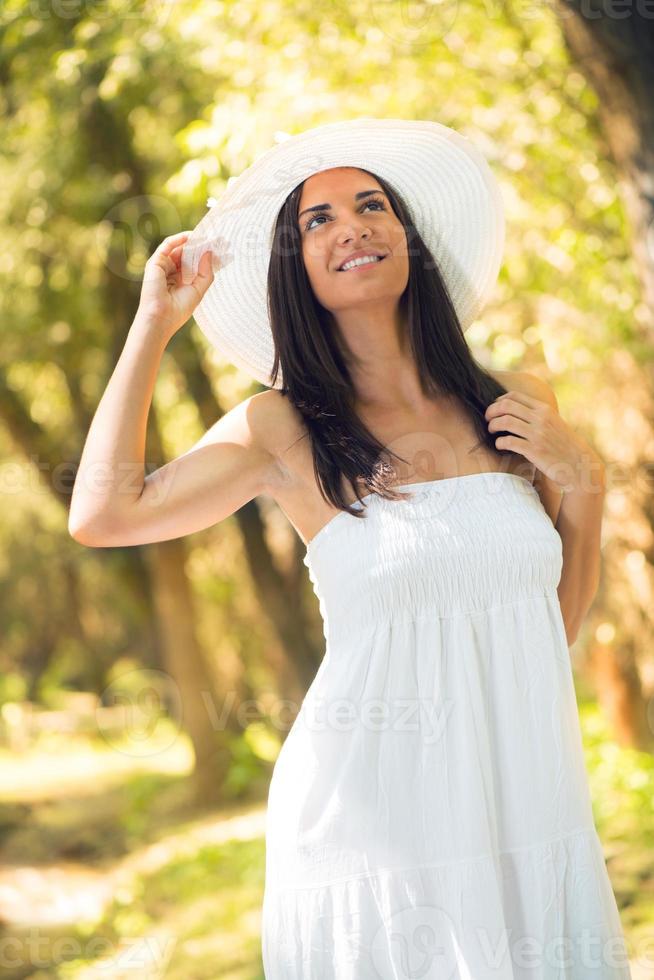 Beautiful woman with white sun hat photo